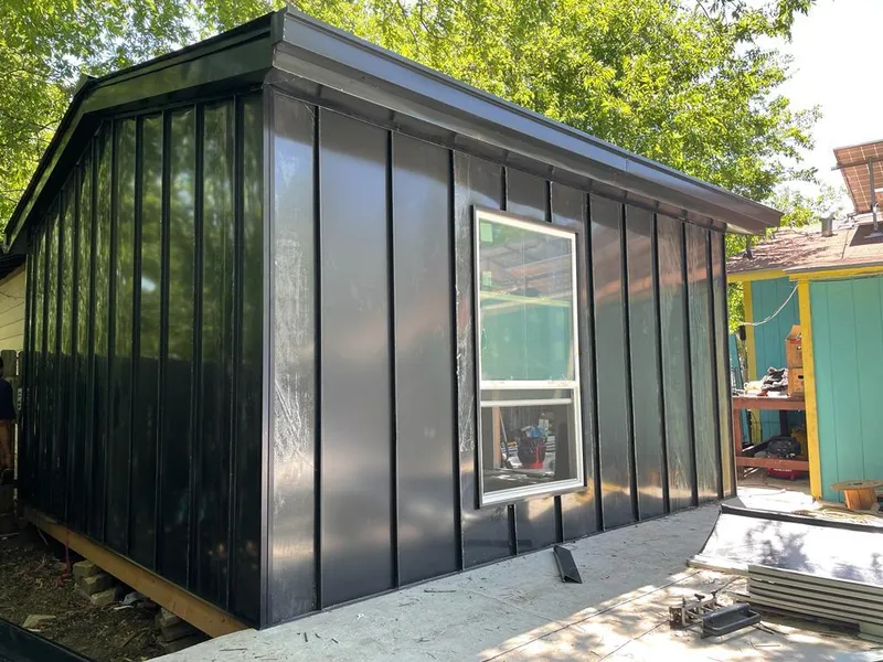 Black standing seam metal wall panels for Roof Inspection in Evanston